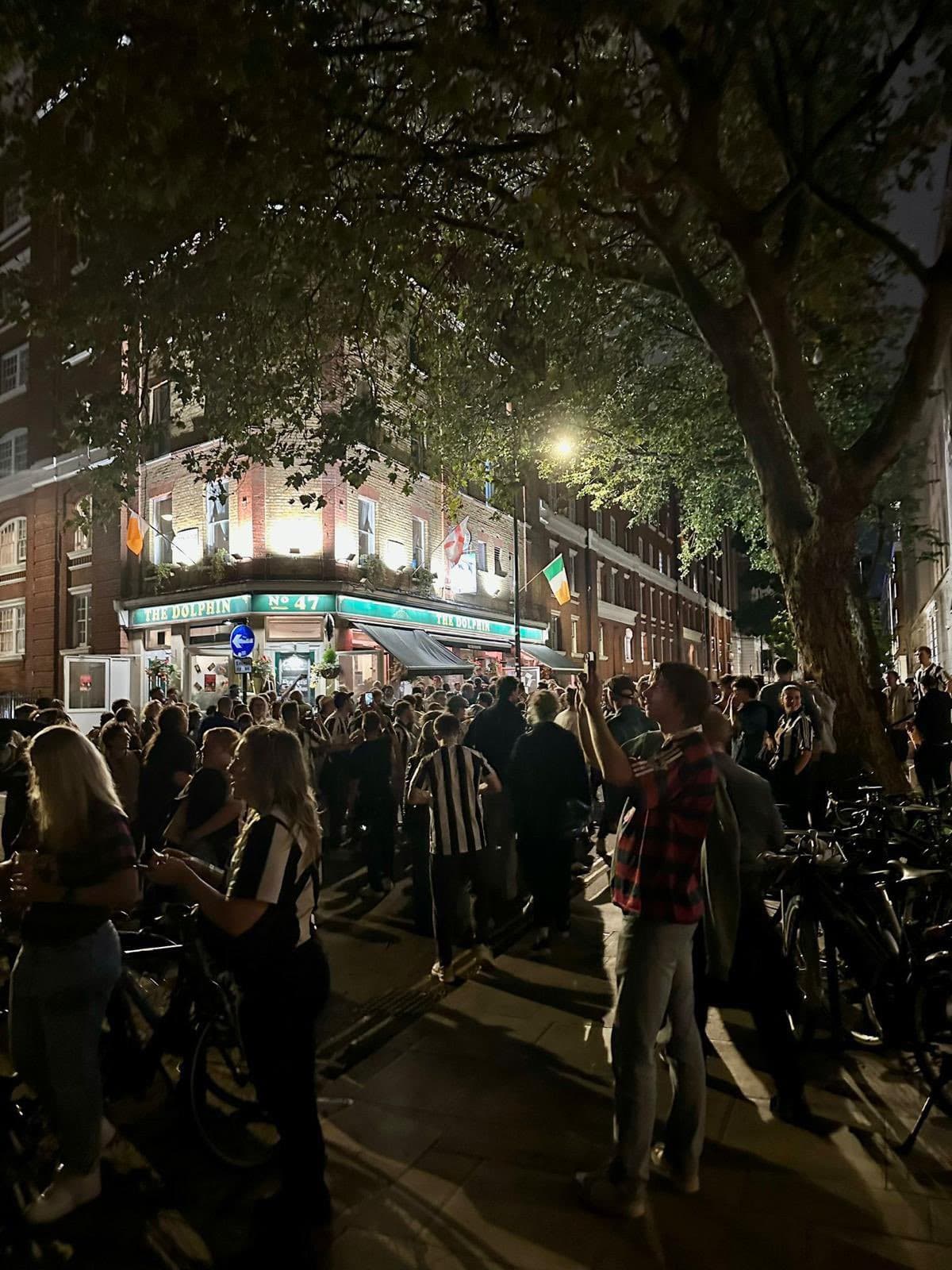 NUSCL supporters outside The Dolphin pub